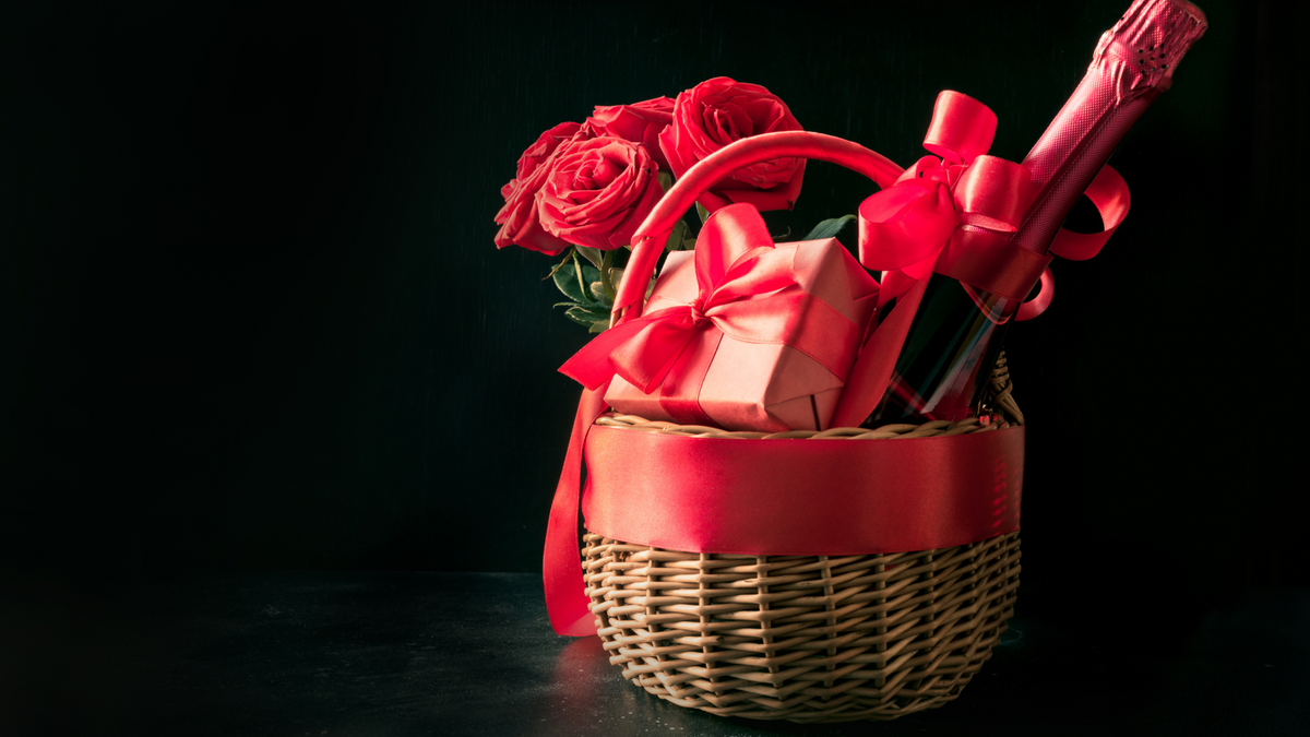 easter basket with red ribbon and gifts inside wrapped in red