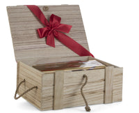 Bottle of bourbon and red wine from Interhampers, arranged in a gift box with decorative packaging and ribbons.