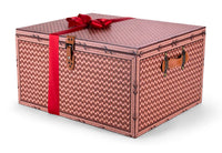 Closed box of Interhampers Indulgence gift set with assorted chocolates and treats in elegant packaging.