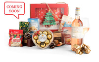 Open box of Sweet Christmas chocolates by Interhampers, featuring festive holiday-themed treats and colorful packaging.