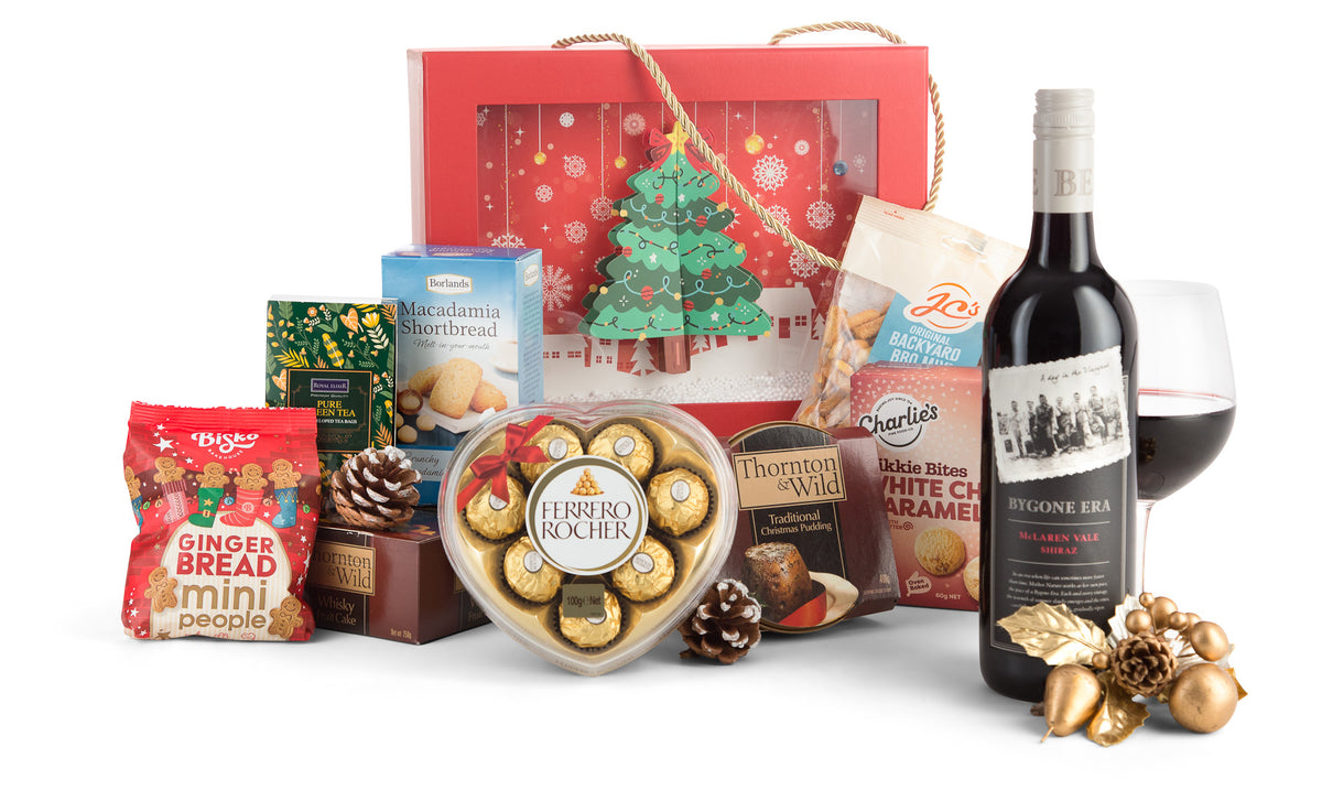 Open red Christmas gift box by Interhampers with festive wrapping and ribbon, ready for holiday celebration.