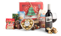 Open red Christmas gift box by Interhampers with festive wrapping and ribbon, ready for holiday celebration.