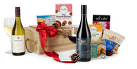Open box of Aussie Delight chocolates by Interhampers, showcasing a variety of colorful chocolate treats inside.