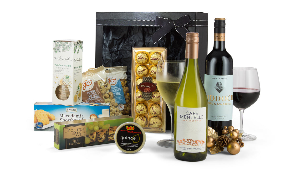 Open cardboard box with packing from Interhampers Ideal Choice product, showing packaging materials and interior view.
