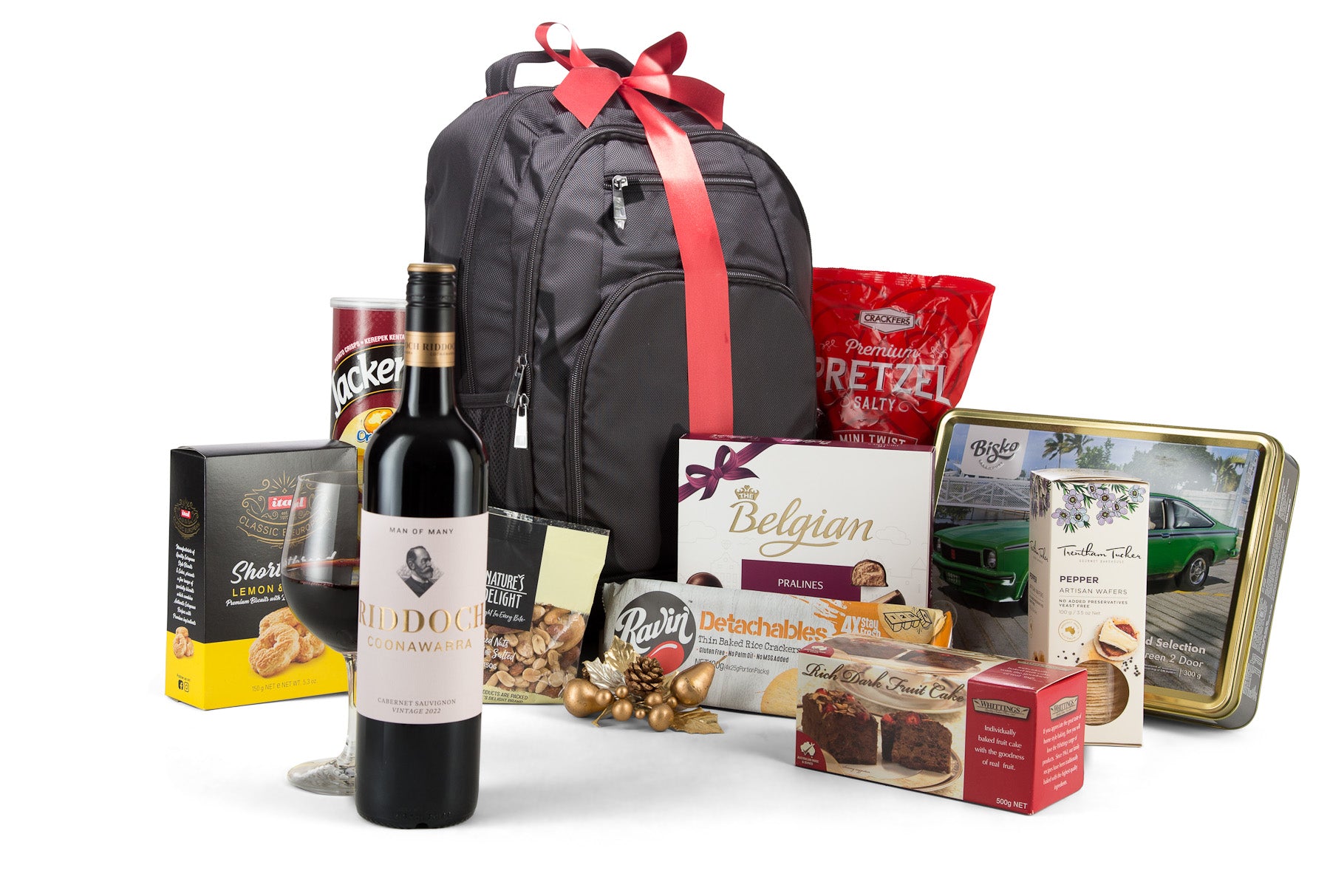Open view of The Executive gift basket by Interhampers featuring assorted gourmet snacks and treats arranged inside a wicker basket.