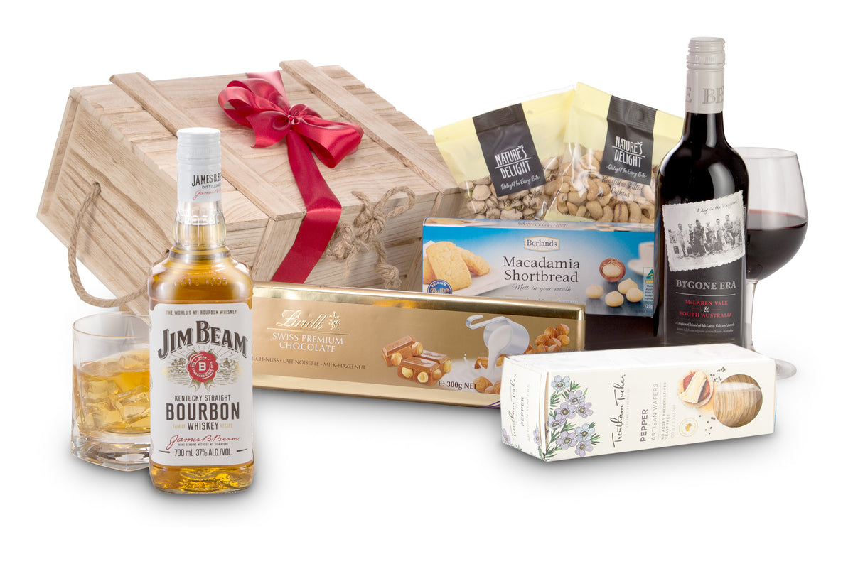 Open bottle of Interhampers Bourbon and Red wine in a glass with a dark background, showcasing rich amber and red hues.