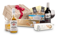 Open bottle of Interhampers Bourbon and Red wine in a glass with a dark background, showcasing rich amber and red hues.