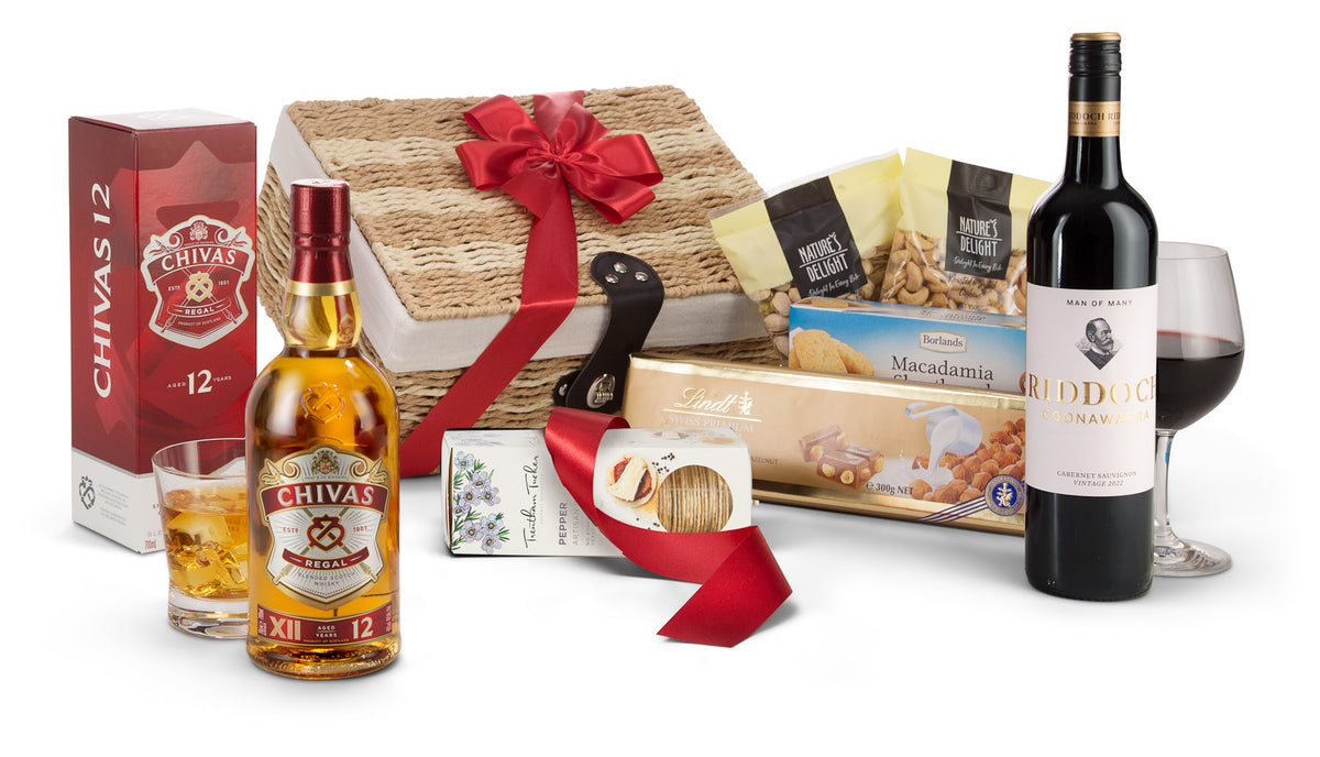 Open regal and red gift box by Interhampers with decorative wrapping, showcasing a luxurious presentation.