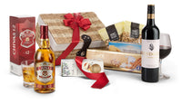 Open regal and red gift box by Interhampers with decorative wrapping, showcasing a luxurious presentation.