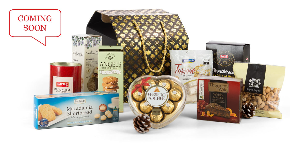 Open black and gold gift box by Interhampers with elegant wrapping and decorative ribbon, ready for gifting.