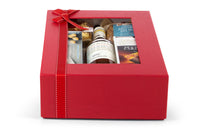 Elegant bottle of Interhampers Sparkling Occasion champagne with a closed cork and decorative foil seal.