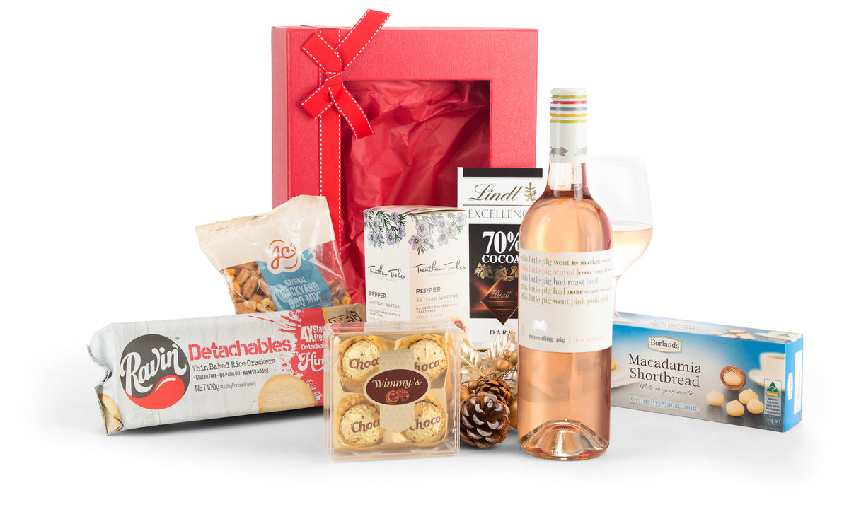 Open bottle of Sparkling Occasion champagne by Interhampers with a gold foil and elegant glass flute on a white background.
