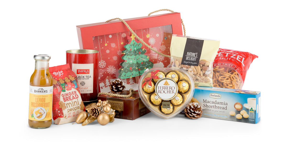 Open Christmas in a Box gift set by Interhampers featuring festive treats and holiday-themed packaging.