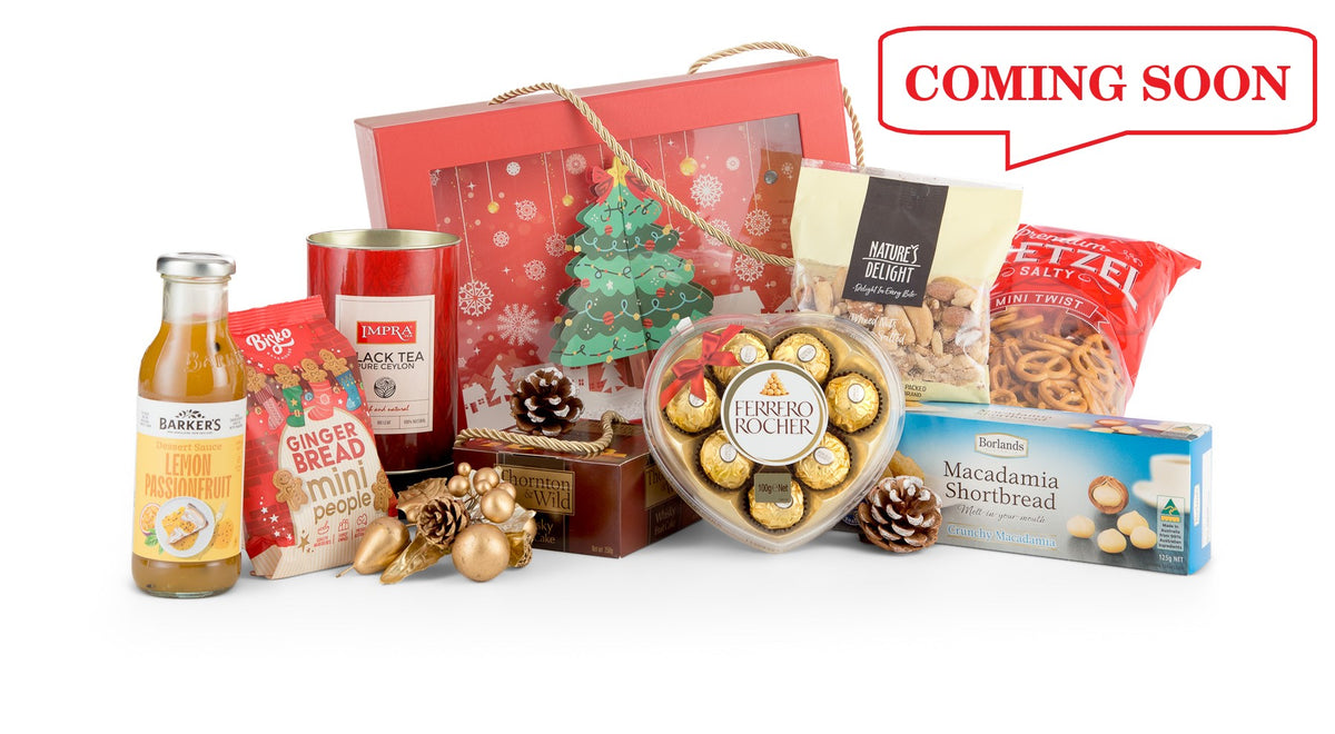 Open Christmas in a Box gift set by Interhampers, featuring festive treats and holiday-themed items arranged in a decorative box.