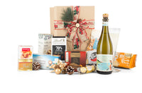Open bottle of Merry Christmas Prosecco from Interhampers, sparkling wine in a festive setting