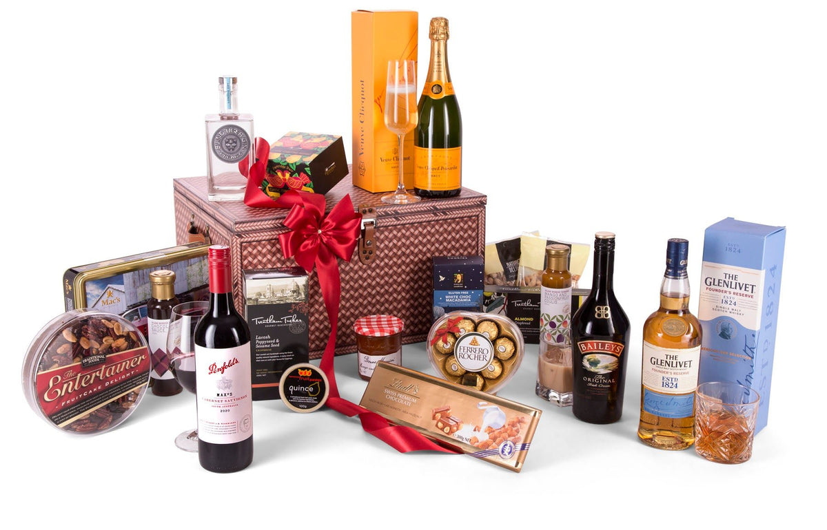 designer printed chest with the luxury hamper produce displayed in front and on top